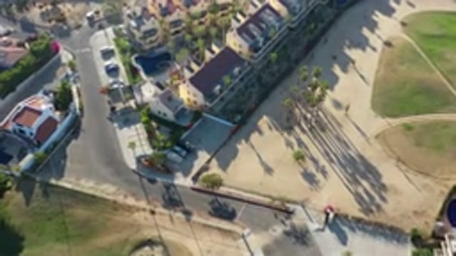 LOS CABOS MEXICO-2020: Aerial View Of Sand And Buildings With Gray Streets