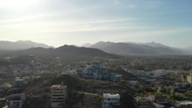 LOS CABOS MEXICO-2020: Flying View Of Building In A Big Hill With City In The Background