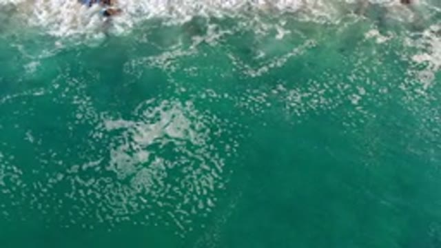 LOS CABOS MEXICO-2020: Waves And White Bubbles In Deep And Green Sea Water