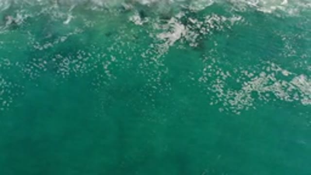 LOS CABOS MEXICO-2020: Overhead View Of Water Over Some Rocks With Small Waves