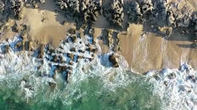 LOS CABOS MEXICO-2020: Water Moves Between Sand And Rocks Toward The Blue Ocean