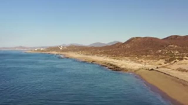 LOS CABOS MEXICO-2020: Sea Water Touching The Sand With Blue Color