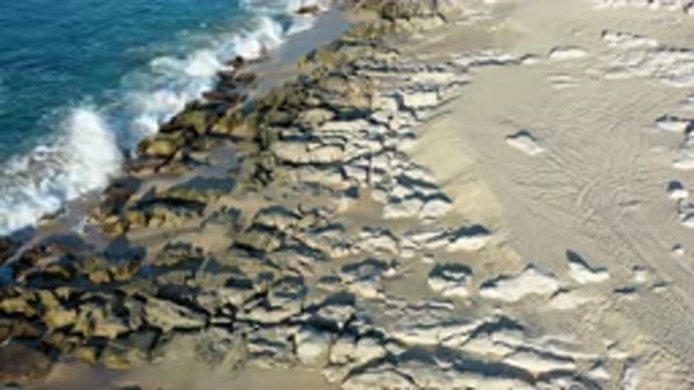 LOS CABOS MEXICO-2020: Waves Crashing Against A Rocky Beach