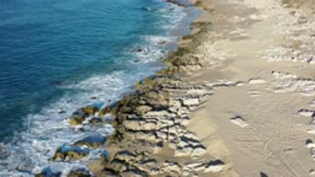 LOS CABOS MEXICO-2020: Waves Crashing On Rocky Shores