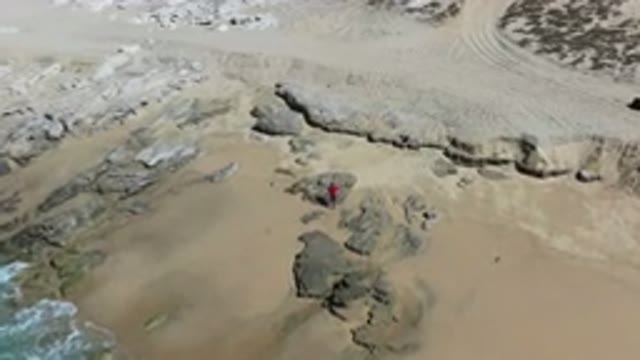 LOS CABOS MEXICO-2020: A Fisherman Carrying A Fishing Rod Walks Away From The Beach