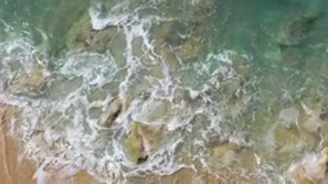 LOS CABOS MEXICO-2020: Beautiful Emerald Water Crashing Over The Rocks On An