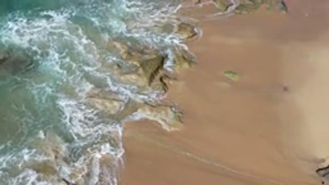 LOS CABOS MEXICO-2020: Beach Sea Water Waves Cross the Sand Area