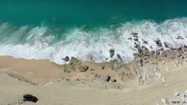 LOS CABOS MEXICO-2020: Sandy Beach Rocks Ocean Waves Ebbing Flowing Aerial View