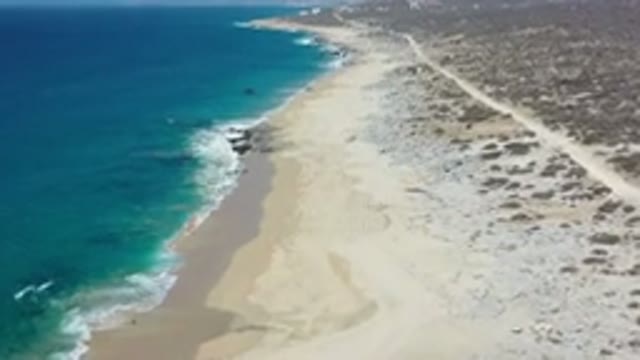 LOS CABOS MEXICO-2020: The Seashore With Tiny Cute Waves Reaching The White Sand