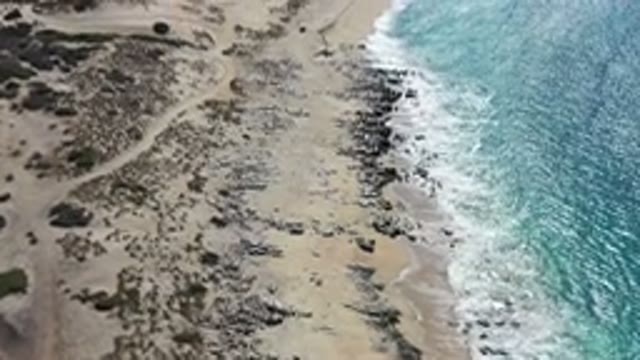 LOS CABOS MEXICO-2020: Rocky Beach Meeting Up Against The Waves Crashing Onto