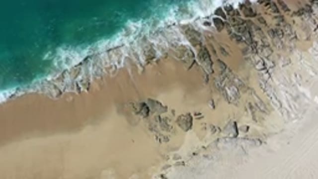 LOS CABOS MEXICO-2020: Waves Crashing On A Rocky Beach
