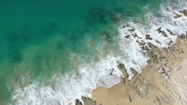 LOS CABOS MEXICO-2020: Aerial View From A Green Water Beach