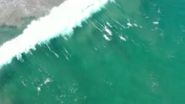 LOS CABOS MEXICO-2020: Strong Waves Crashing on a Beach from a Deep Green Sea