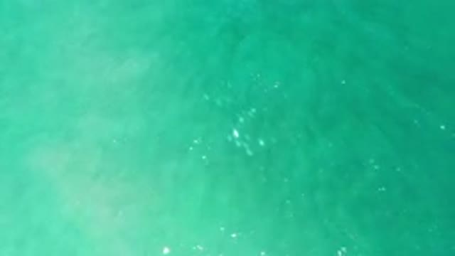 LOS CABOS MEXICO-2020: Small Ripples Gently Flowing Through Dark Turquoise Blue