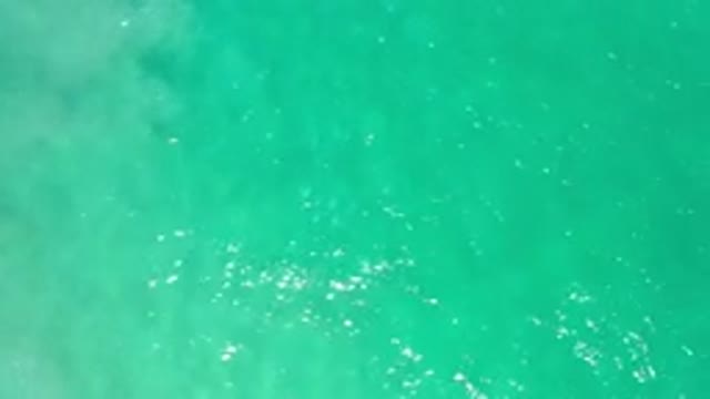 LOS CABOS MEXICO-2020: Crystal Clear Green Ocean Water Rippling In The Bright