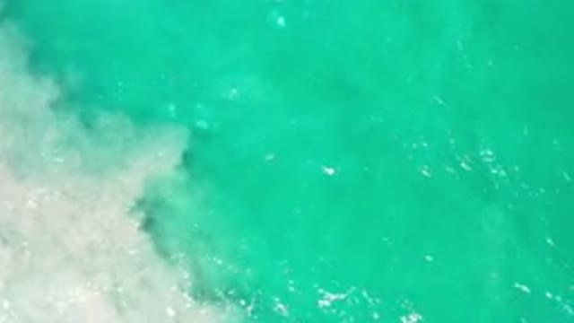 LOS CABOS MEXICO-2020: Blue Green Ocean Water Mixing With Brown Ocean Water