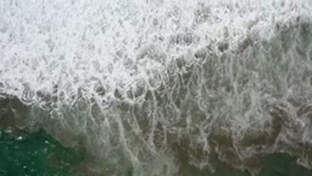 LOS CABOS MEXICO-2020: Teal Beach Shoreline Sea Foam Water Waves Ebbing Flowing