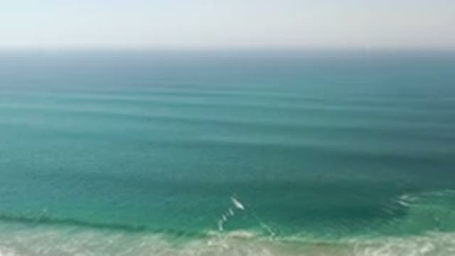 LOS CABOS MEXICO-2020: Blue Sea Ocean Rolling Waves Surf Clear Sky Calm Day