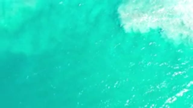LOS CABOS MEXICO-2020: An Overhead View Of Green Water Flowing Into White Water