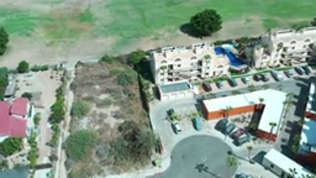 LOS CABOS MEXICO-2020: Buildings Pool Cars Parking And Dry Sunny Landscaping