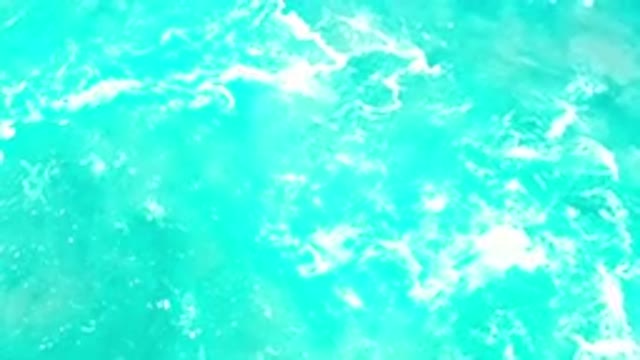 LOS CABOS MEXICO-2020: Bright Blue Ocean Water Flowing With Ripples And Foam On