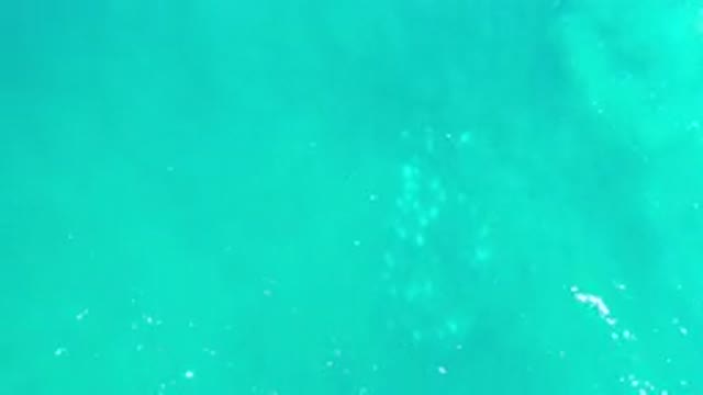 LOS CABOS MEXICO-2020: The Top View Of The Blue Sea Water With Moving Clouds