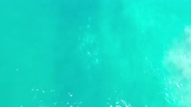 LOS CABOS MEXICO-2020: One Small Wave In The Middle Of A Teal Clear Ocean