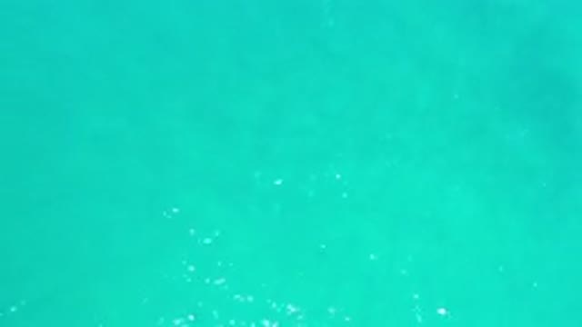 LOS CABOS MEXICO-2020: Blue Green Gradient Water With Waves And Reflections
