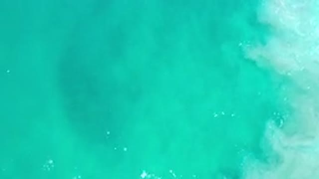 LOS CABOS MEXICO-2020: A View Of A Teal Blue Sea With Small Waves And Light