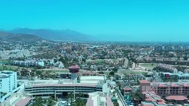 LOS CABOS MEXICO-2020: A View Of A Huge Resort Like Building With An Umbrella
