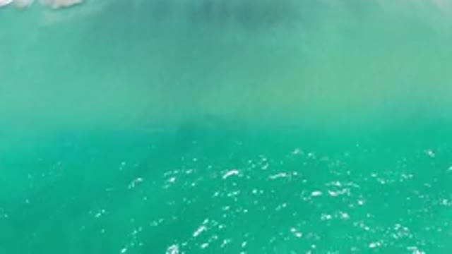 LOS CABOS MEXICO-2020: Beautiful Green Water Beach Making A Wave Seen From Above