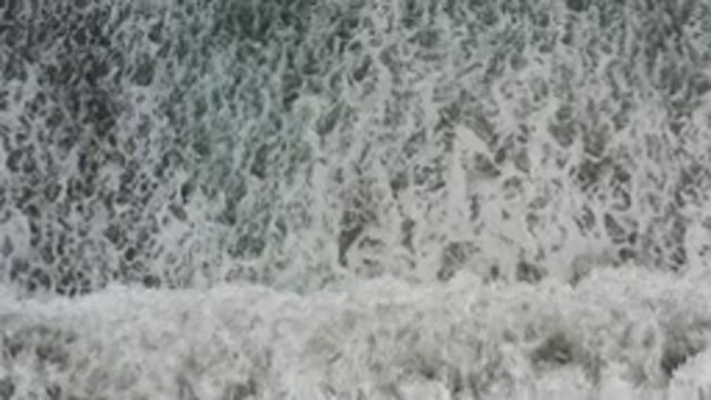 LOS CABOS MEXICO-2020: Moving Top View Of Ocean Waves Crashing Into The Beach