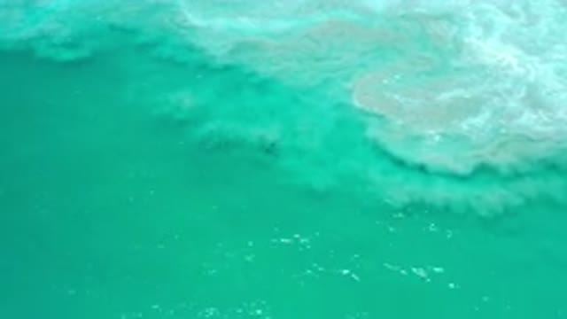 LOS CABOS MEXICO-2020: Green Sea With White Foam On A Clear Day