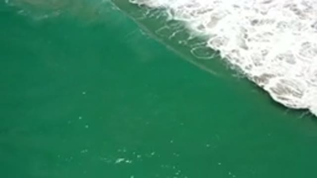LOS CABOS MEXICO-2020: Green Ocean Waves Flowing And Crashing Creating A