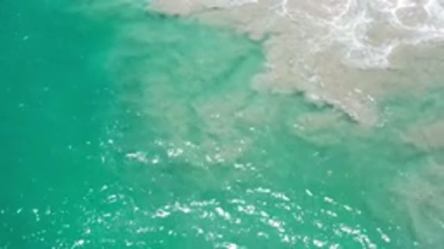 LOS CABOS MEXICO-2020: Overhead View Of Ocean And Sand Mixing