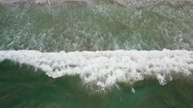 LOS CABOS MEXICO-2020: Aerial Shot Of Ocean Waves Crushing On The Sandy Beach