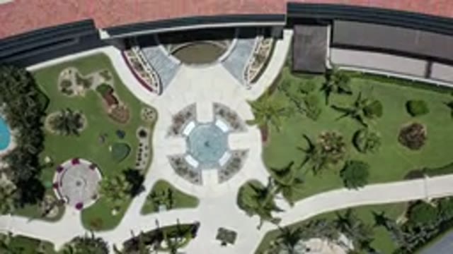 LOS CABOS MEXICO-2020: Green Space With Trees Followed By Red And Gray Rooftops
