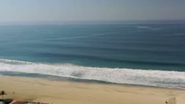 LOS CABOS MEXICO-2020: Drone Shot Of Azure Waves Crashing On A Pristine Beach