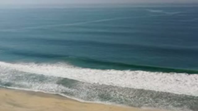 LOS CABOS MEXICO-2020: Deep Blue Ocean Water Turns To Green And Then Foamy White