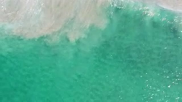 LOS CABOS MEXICO-2020: The Movement Of The Translucent Green Sea Waves Under The