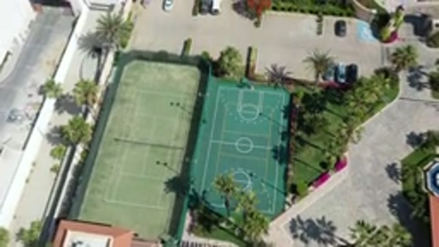 LOS CABOS MEXICO-2020: Aerial View Of A Tennis And Basketball Court And Parking