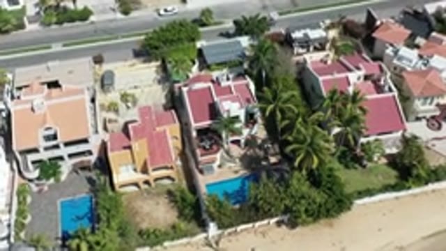 LOS CABOS MEXICO-2020: Sky View of Houses with Swimming Pool, Streetlamp and Sand