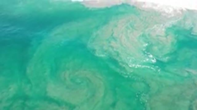 LOS CABOS MEXICO-2020: Ocean Showing Waves While The Water Hits The Sand Land