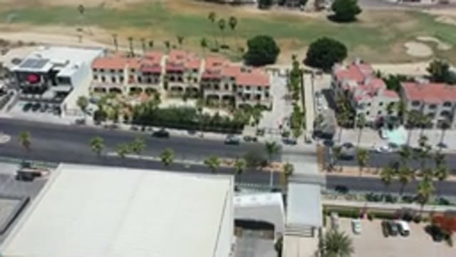 LOS CABOS MEXICO-2020: Flyover of Small Resort Town with Car Driving Down Road