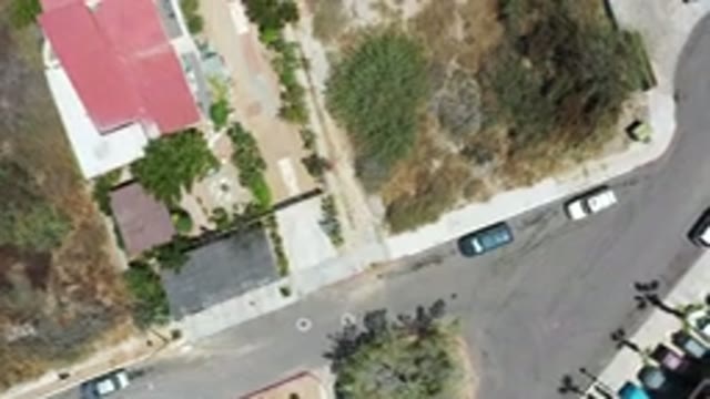LOS CABOS MEXICO-2020: Aerial View Of Cars Parked On A Street And Buildings