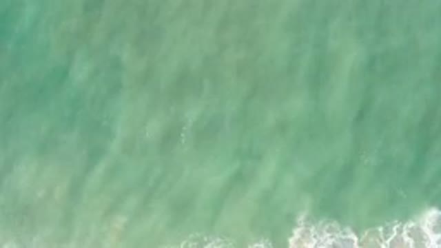 LOS CABOS MEXICO-2020: Aerial View Of A Beautiful Green Ocean And Some Waves