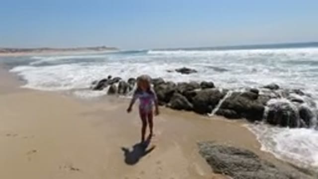LOS CABOS MEXICO-2020: Child And Her Dog Enjoying The Beach