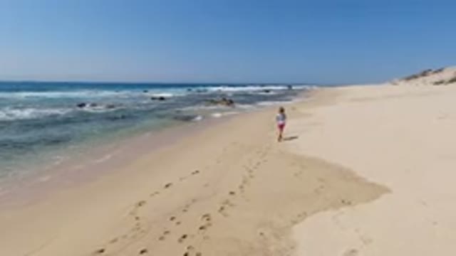 LOS CABOS MEXICO-2020: Beautiful View Of The Beach With A Person Running In The