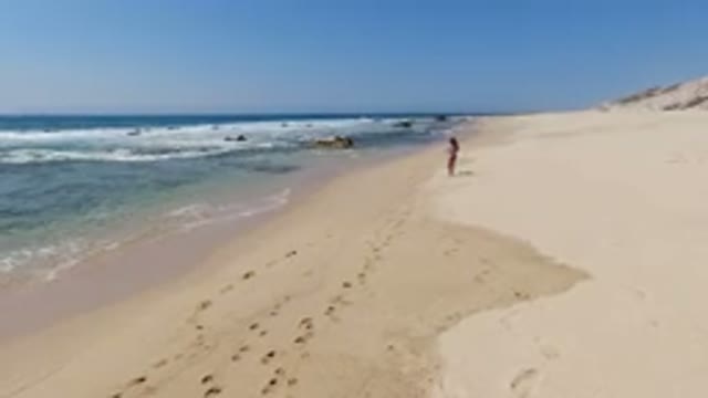 LOS CABOS MEXICO-2020: A Kid Enjoying a Walk on the Beautiful Beach