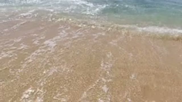 LOS CABOS MEXICO-2020: Small Waves on a Beach on a Clear Day